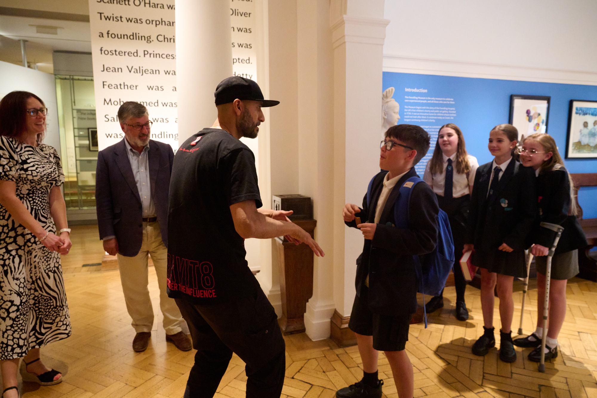 Beatboxer Danny and a child in school uniform perform in The Foundling Museum